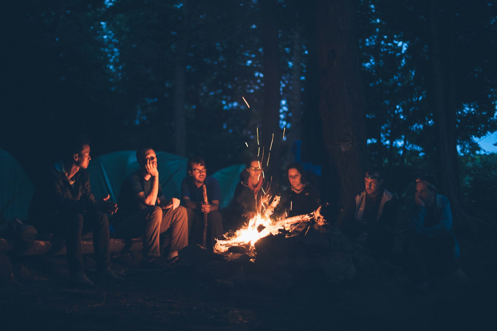 A tent set up in a quiet outdoor camp.