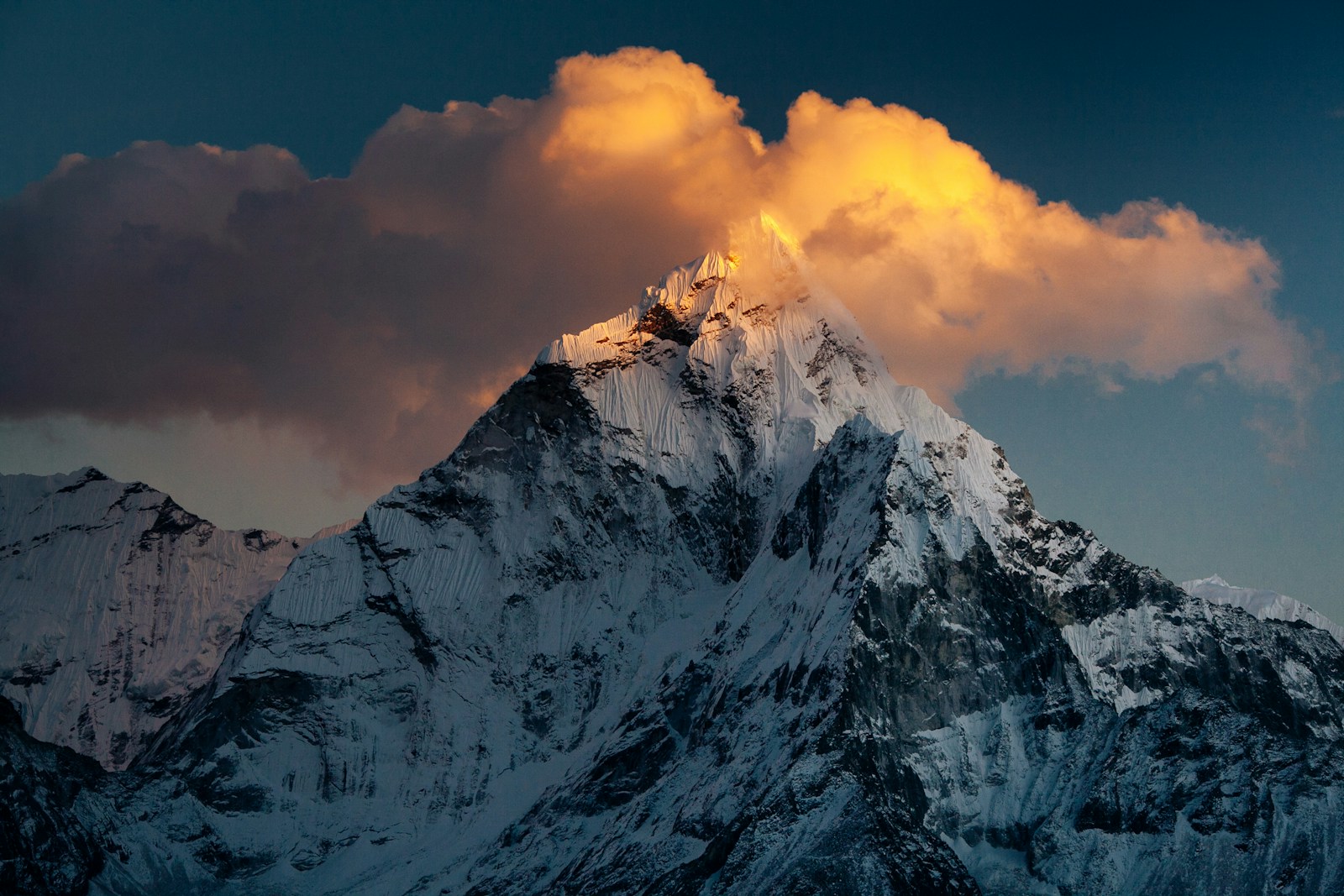 A still mountain lake below distant peaks.