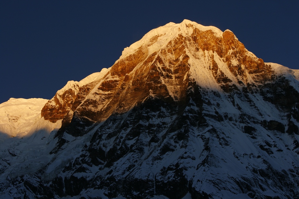 First light hits Annapurna I at 8,091 m (26,545 ft) | Ali Beittoei Annapurna Sanctuary
